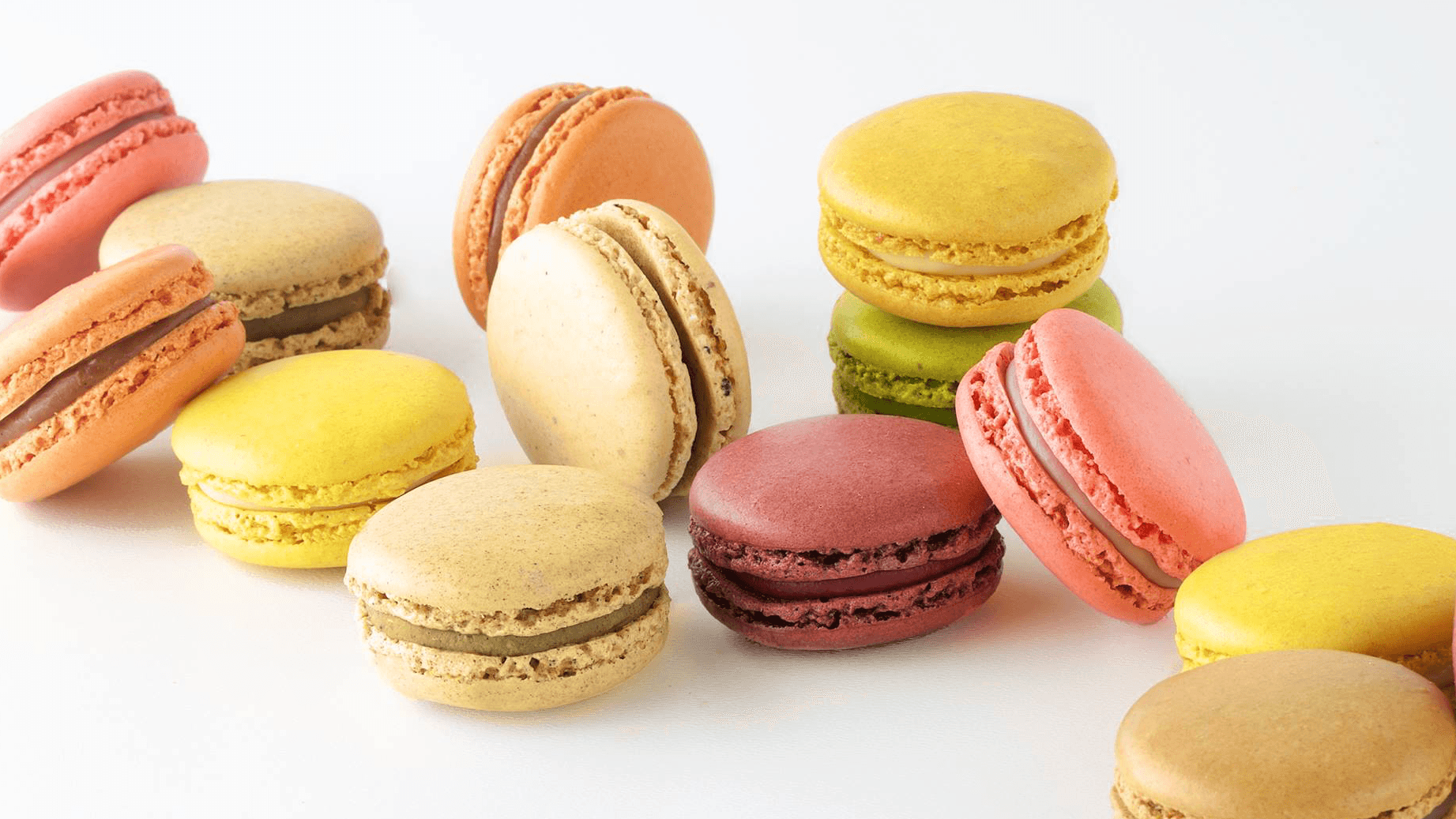 Macaroons in different colours with white backround 