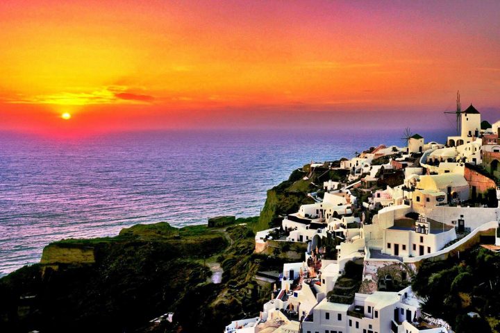 Astonishing places to experience the sunset - Santorini, Greece: Sunset Splendor Amidst the Cliffs