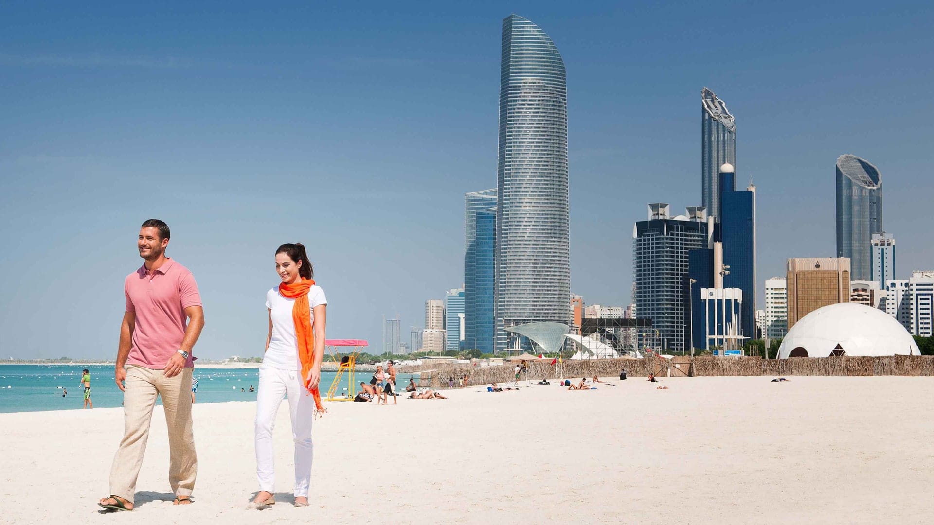 a couple walking on the beach