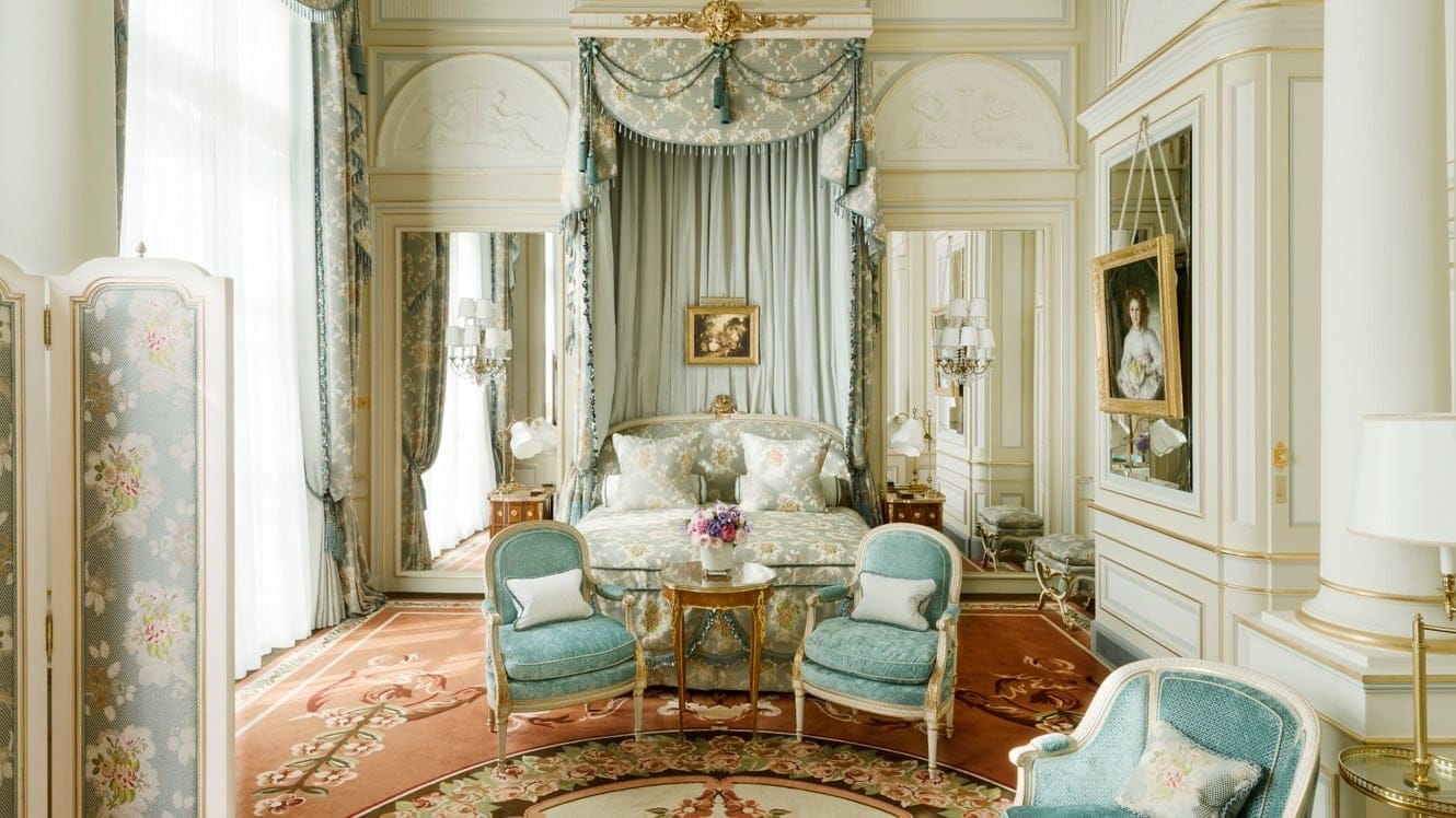 Suite bedroom at hotel ritz, paris with a flower design and a white and blue look