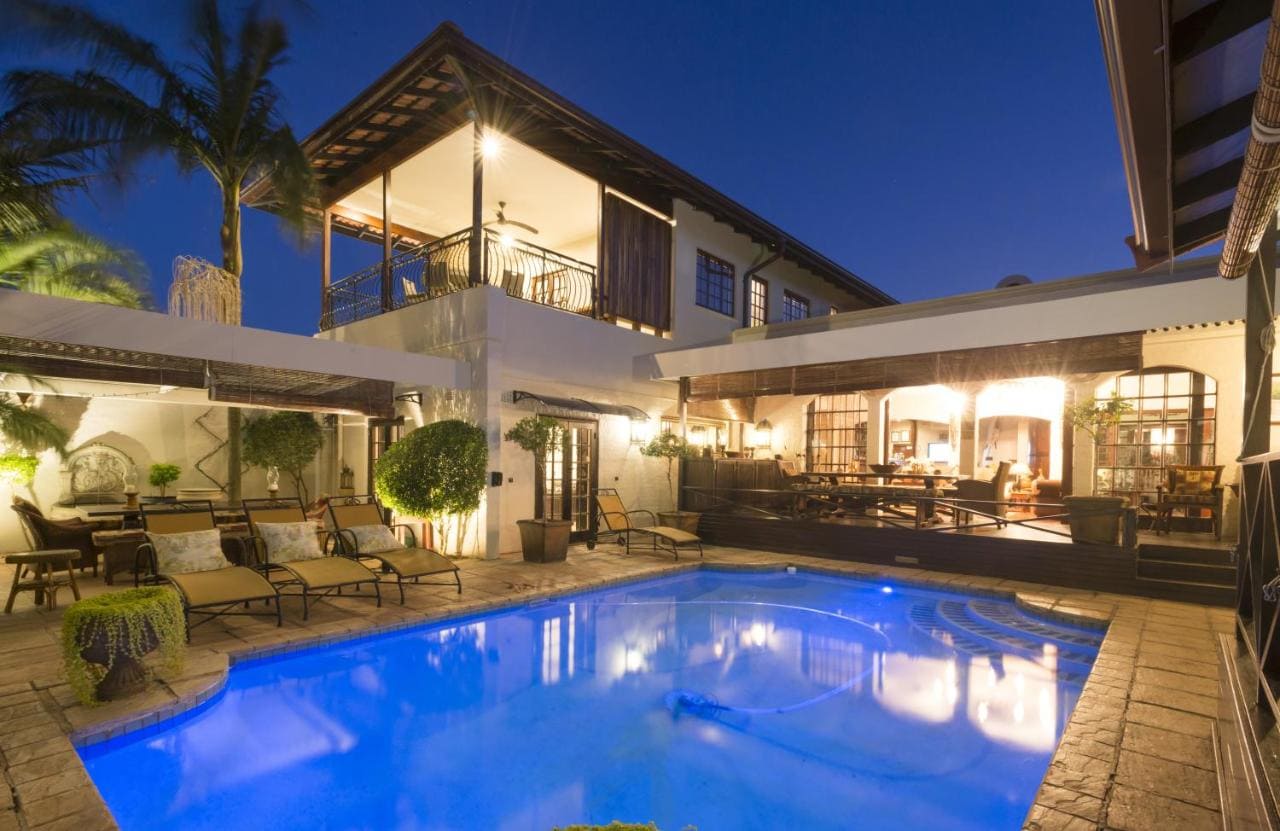 Pool and outside seating area at Five Burnham Luxury Guest House