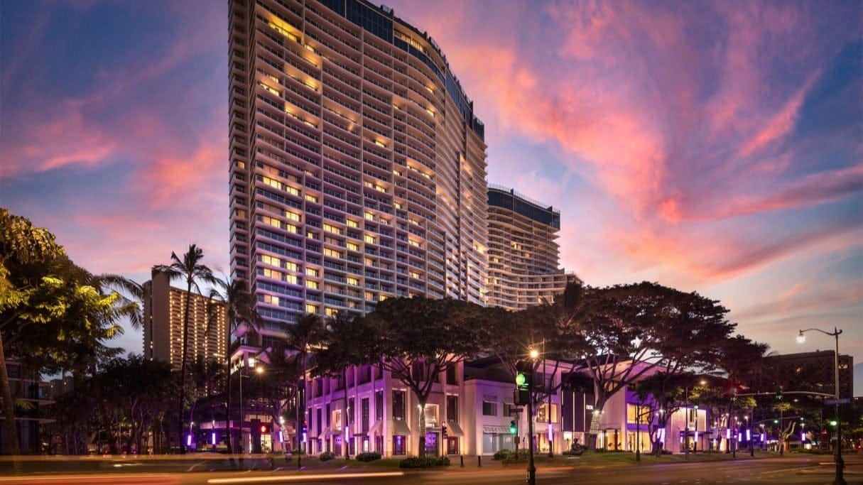 Outside The Ritz-Carlton Residences, Waikki Beach with purple lighting.